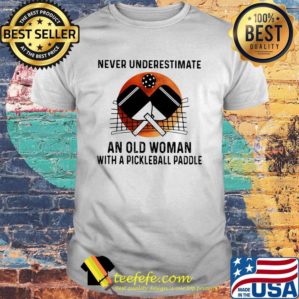 NEVER UNDERESTIMATE AN OLD WOMAN WITH A PICKLEBALL PADDLE SUNSET SHIRT