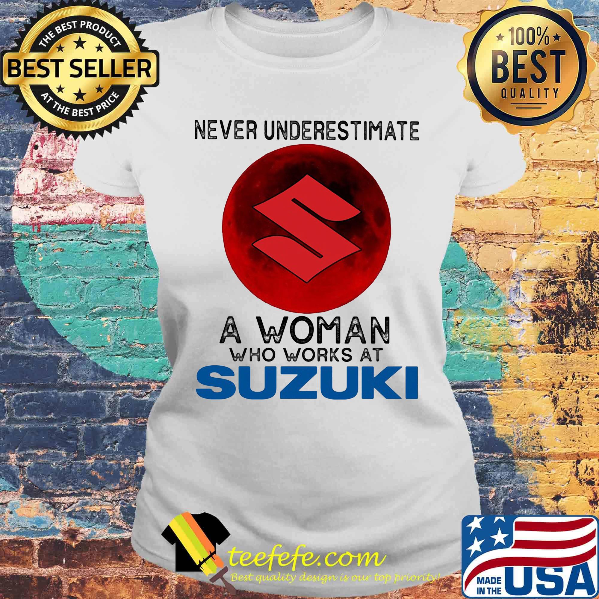 Never underestimate a woman who works at suzuki sunset s Laides tee Never underestimate a woman who works at suzuki sunset s Laides tee