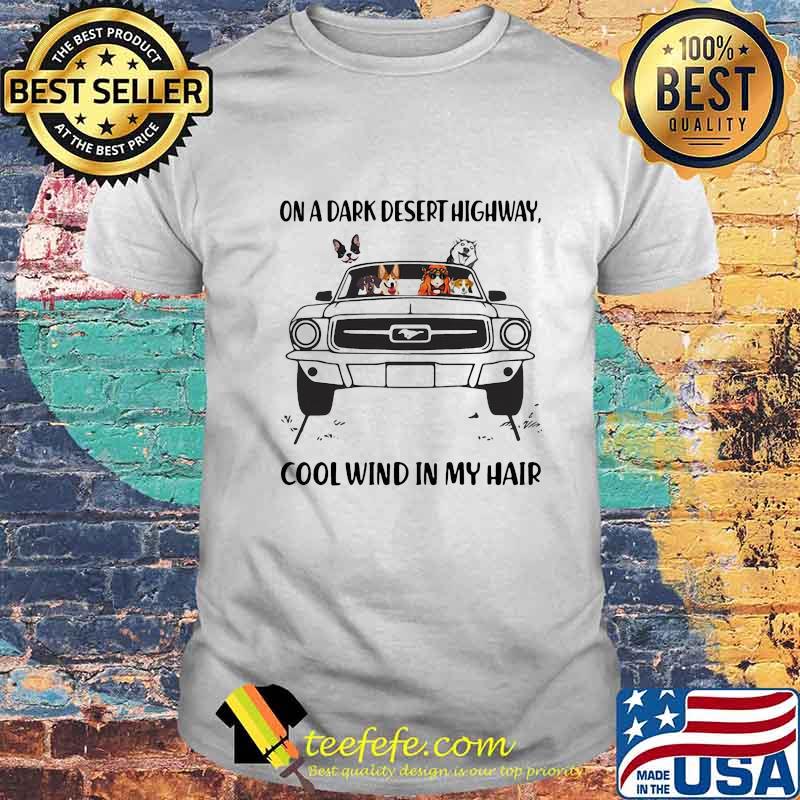 Girl and dogs driving car dinosaur on a dark desert highway cool wind in my hair shirt