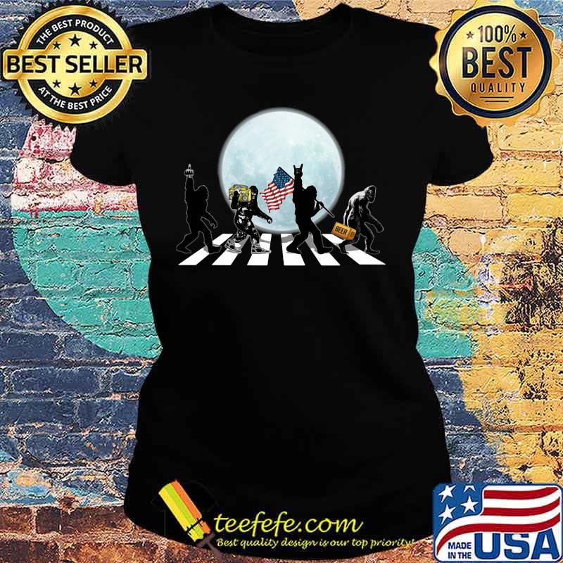 THE BIGFOOTS CROSSING THE LINE BEER RADIO AMERICAN FLAG WALK IN THE MOON SHIRT Ladies tee THE BIGFOOTS CROSSING THE LINE BEER RADIO AMERICAN FLAG WALK IN THE MOON SHIRT Ladies tee