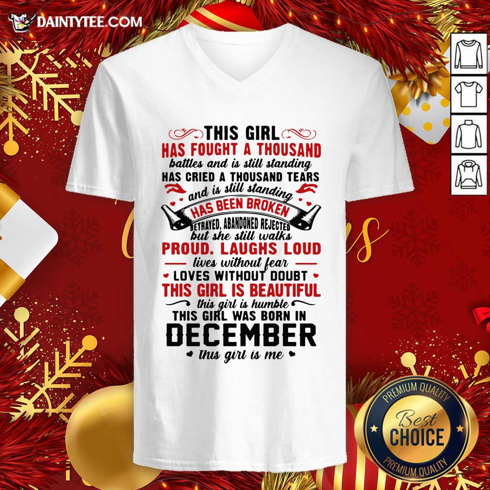 hot-this-girl-has-fought-a-thousand-battles-this-girl-was-born-in-december-v-neck.jpg
