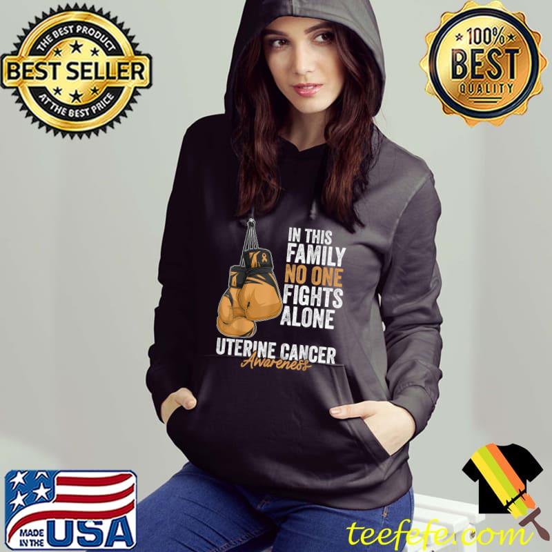 In this family no one fights alone Uterine Cancer Awareness Month Boxing Gloves Peach Ribbon T-Shirt Hoodie In this family no one fights alone Uterine Cancer Awareness Month Boxing Gloves Peach Ribbon T-Shirt Hoodie