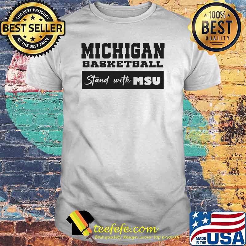 Michigan basketball stand with MSU shirt