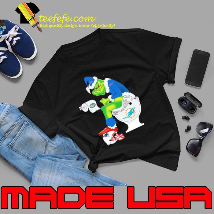 Buffalo Bills Grinch Sitting On Miami Dolphins Toilet And Step On New England Patriots Helmet 2024 Shirt Unisex Buffalo Bills Grinch Sitting On Miami Dolphins Toilet And Step On New England Patriots Helmet 2024 Shirt Unisex