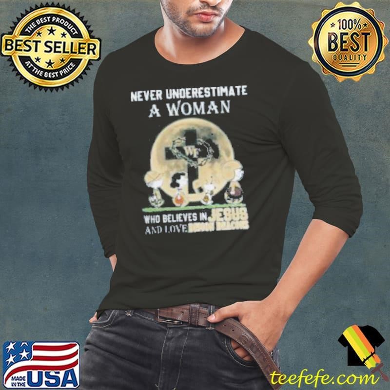Peanuts Characters Never Underestimate A Woman Who Believes In Jesus And Loves Wake Forest Demon Deacons Long Sleeve Tee