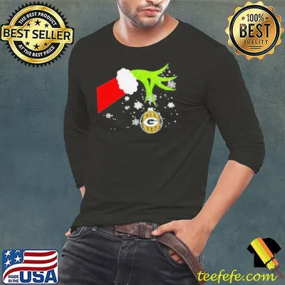 Grinch hand holding ornament Packers football Christmas shirt