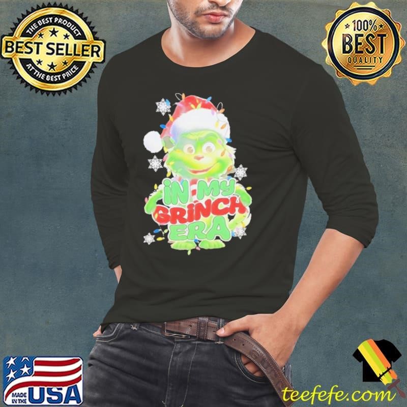 Santa hat in my Grinch era Christmas shirt